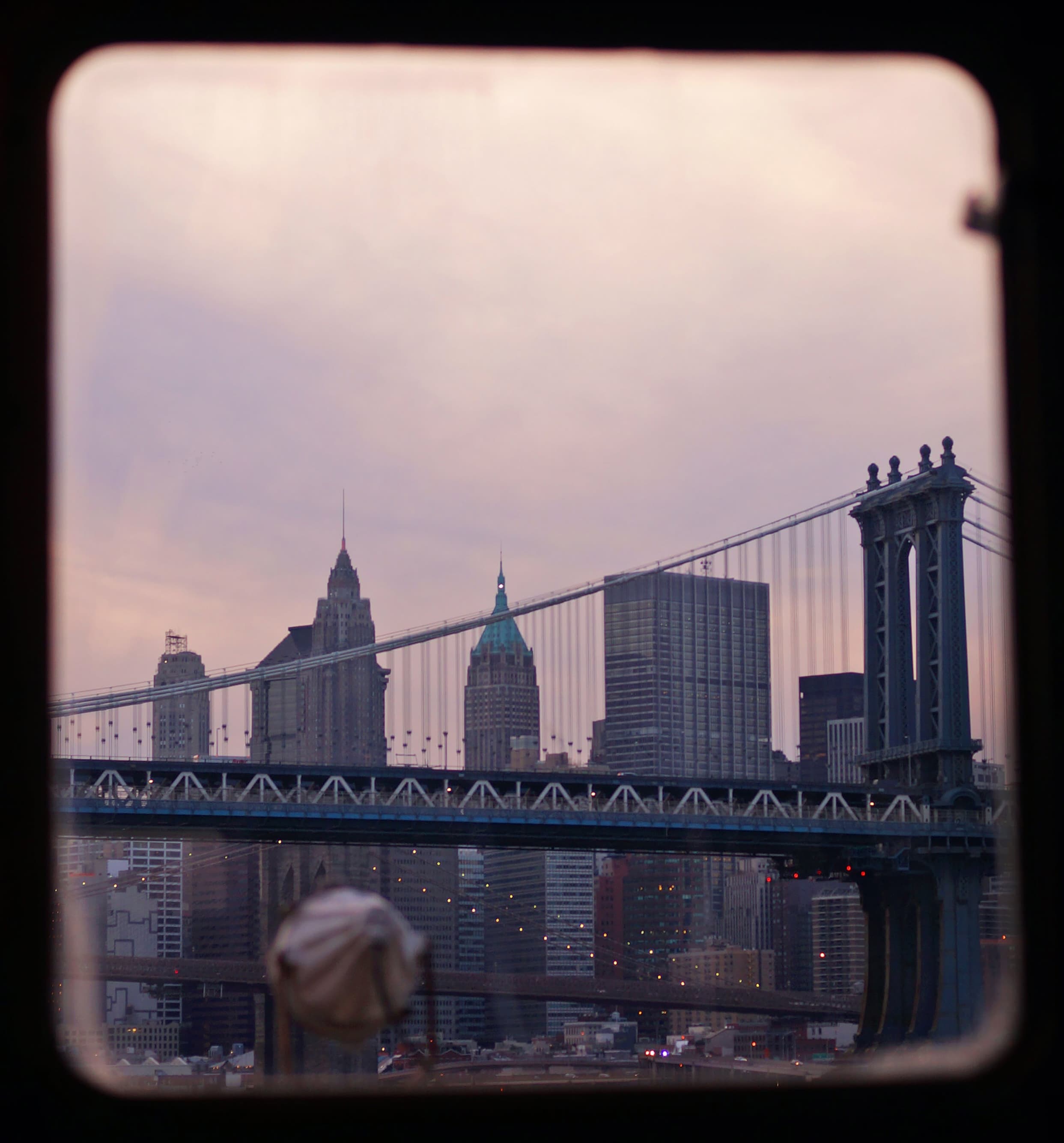 Peeking through NYC subway window